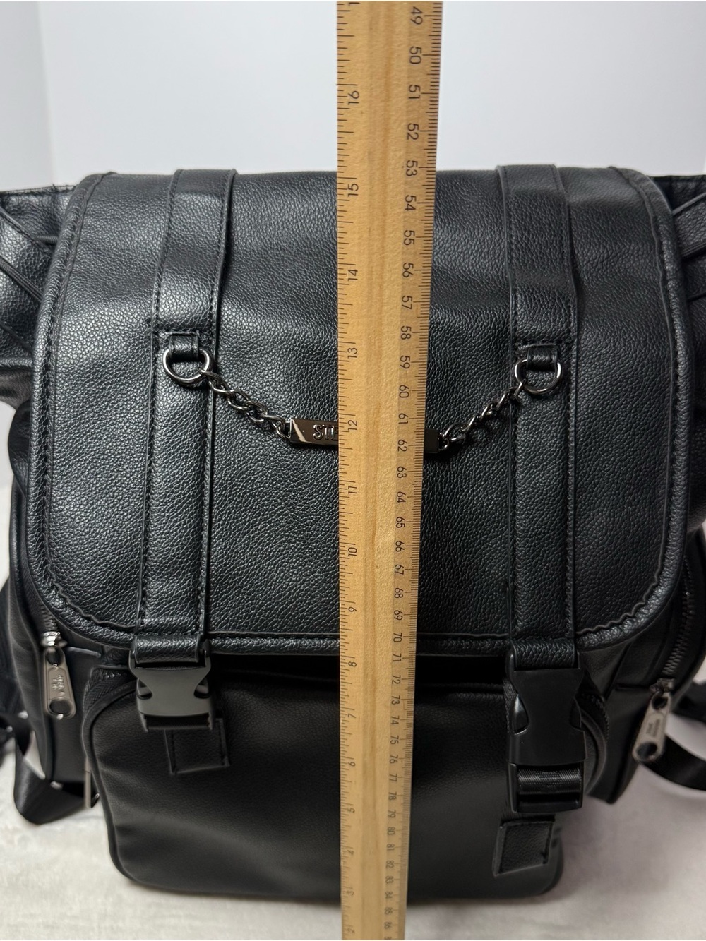 Steve Madden Black Pebbled Faux Leather Drawstring Backpack with Chain Trim - Picture 6 of 8